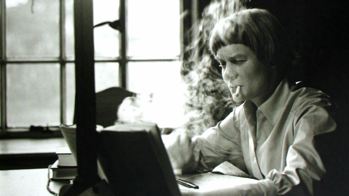 1) Iris Murdoch writing at her Oxford home in 1958